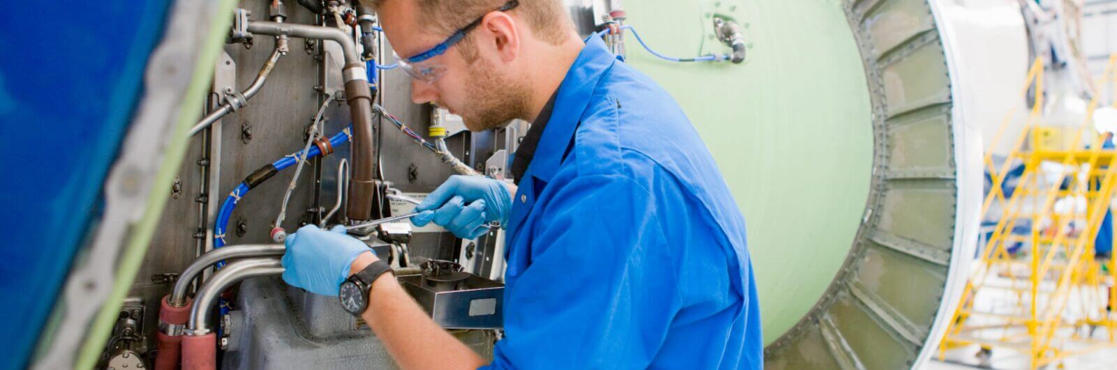 Engineer working on an airplane engine