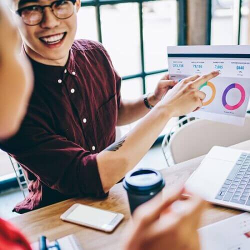 Young marketing team reviewing analytics data