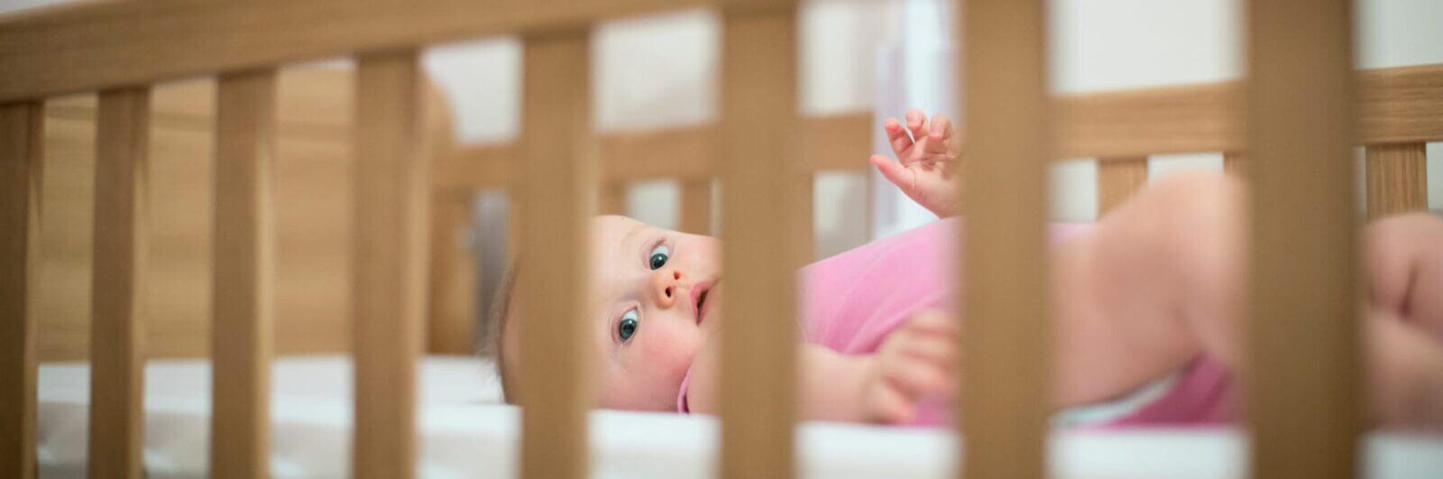 Baby in a comfy crib