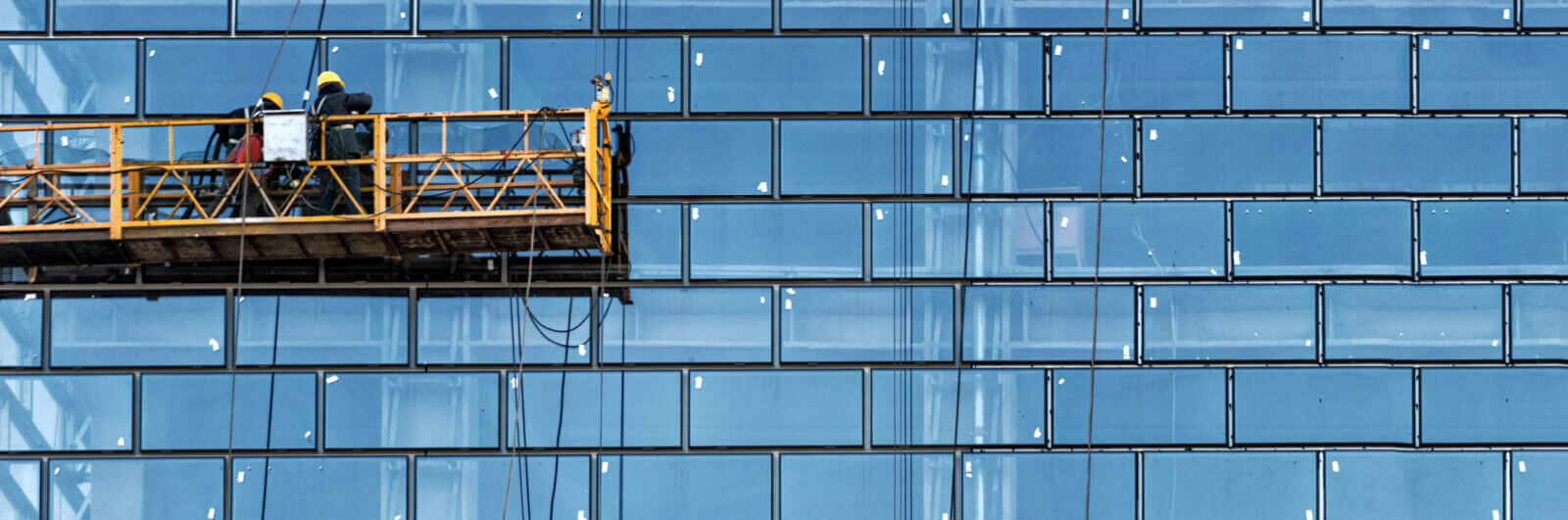 Workers washing windows on a skyscraper