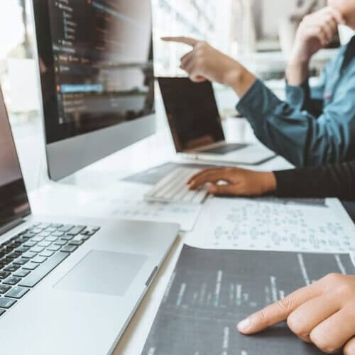 Computer programmers compiling code