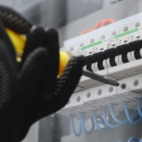 Electrician wiring circuit breakers