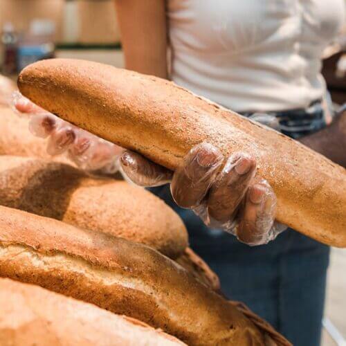 A couple selecting a loaf of bread