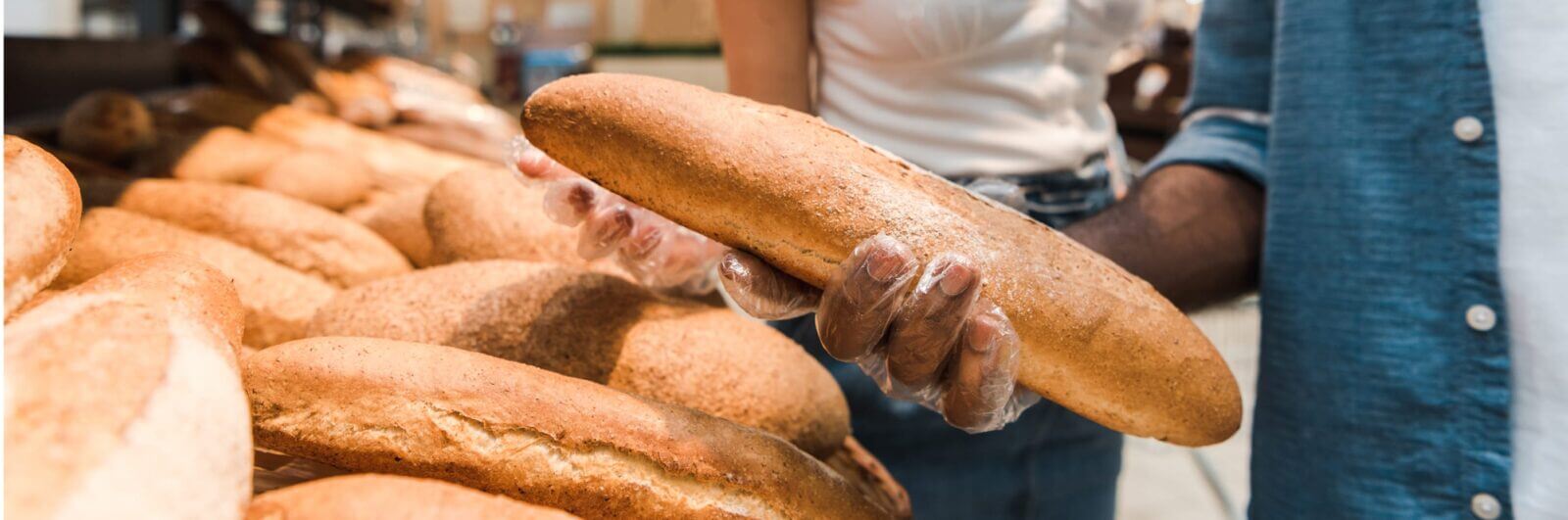 A couple selecting a loaf of bread