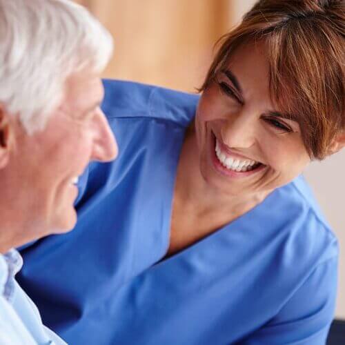 Young nurse and an older patient