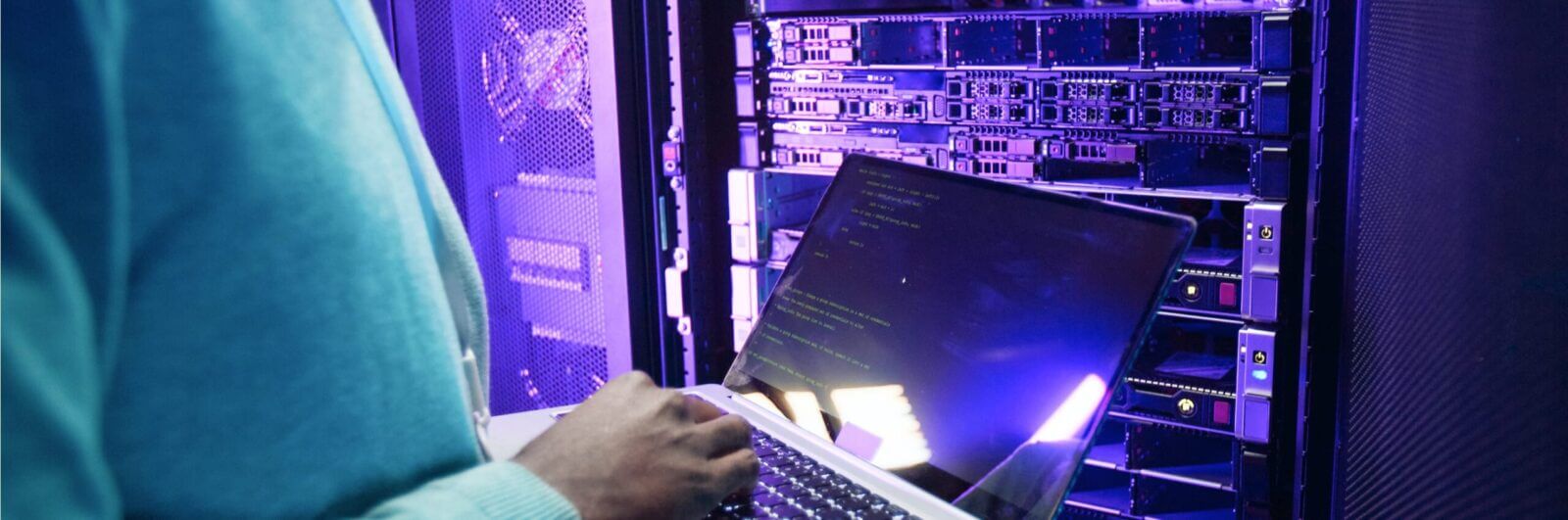 I.T. tech checking data points in a server room