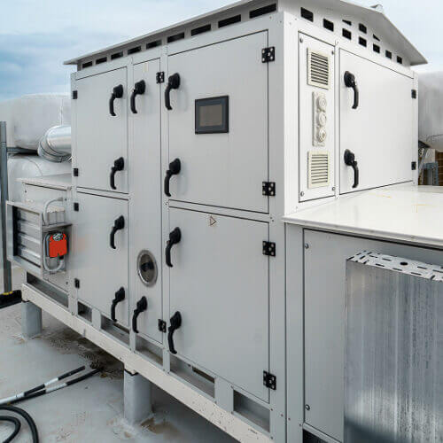 HVAC equipment on the roof of a tall building