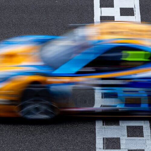 Motion blur of a race car crossing the finish line