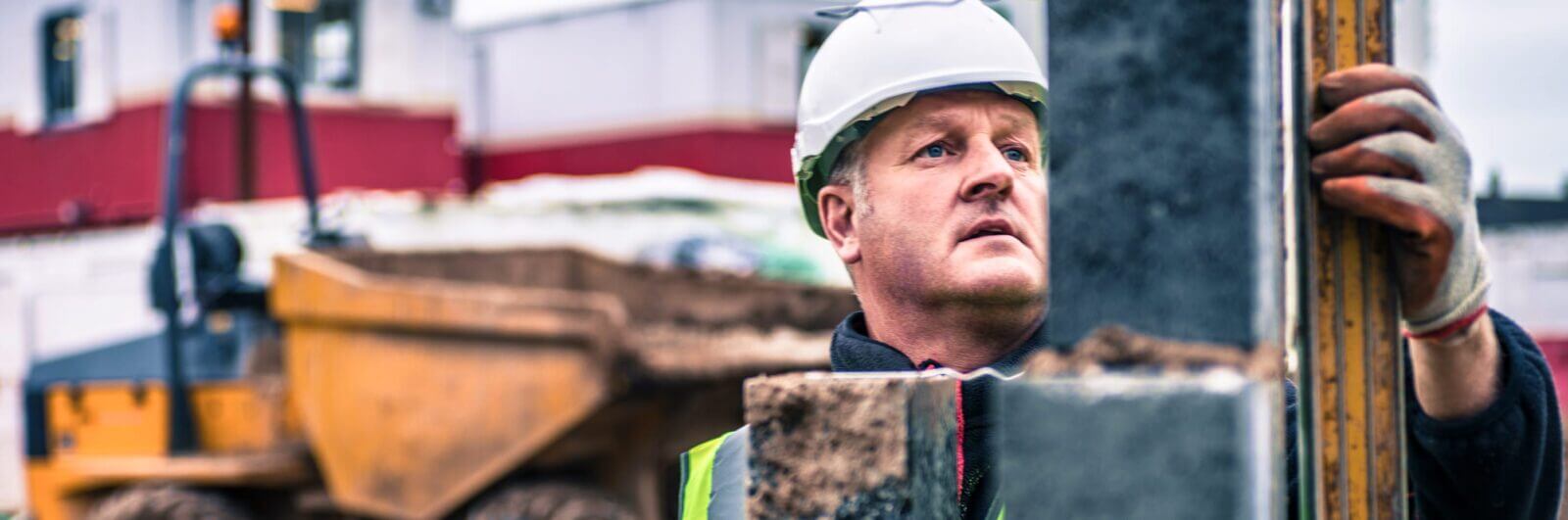 Construction worker inspecting a piling